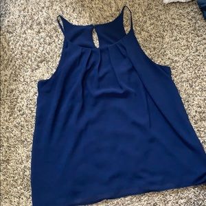 Tank top with buttoned peep hole in back.